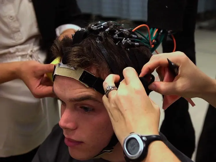Functional Near Infrared Spectroscopy of the Sensory and Motor Brain Regions with Simultaneous Kinematic and EMG Monitoring During Motor Tasks