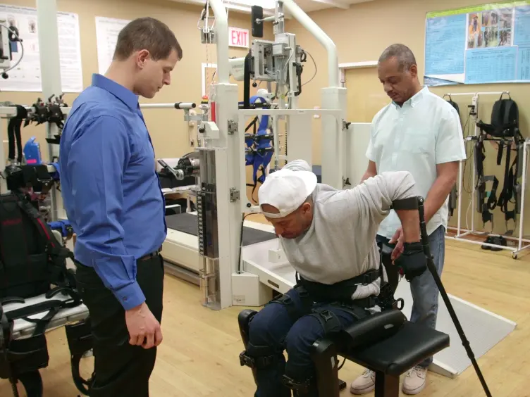 Training Persons with Spinal Cord Injury to Ambulate Using a Powered Exoskeleton