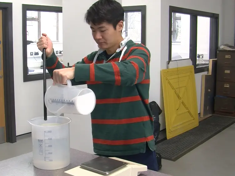 Ice Generation and the Heat and Mass Transfer Phenomena of Introducing Water to a Cold Bath of Brine