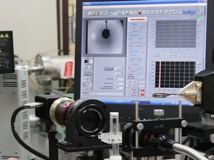 Near-Infrared Temperature Measurement Technique for Water Surrounding an Induction-heated Small Magnetic Sphere
