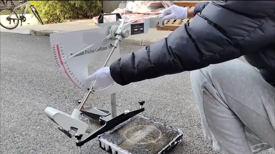 Determination of the Friction Coefficients of Icy Pavements Under Different Amounts of Snowfall